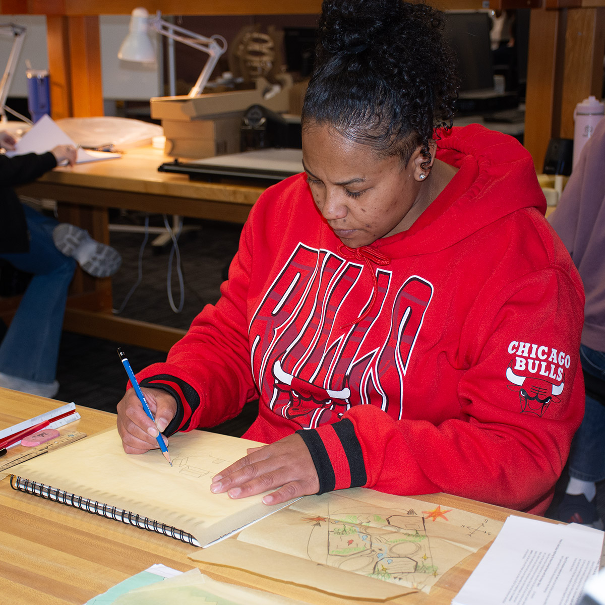 Black, female 英雄联盟博彩竞猜 Architectural Technologies student creating a floorplan
