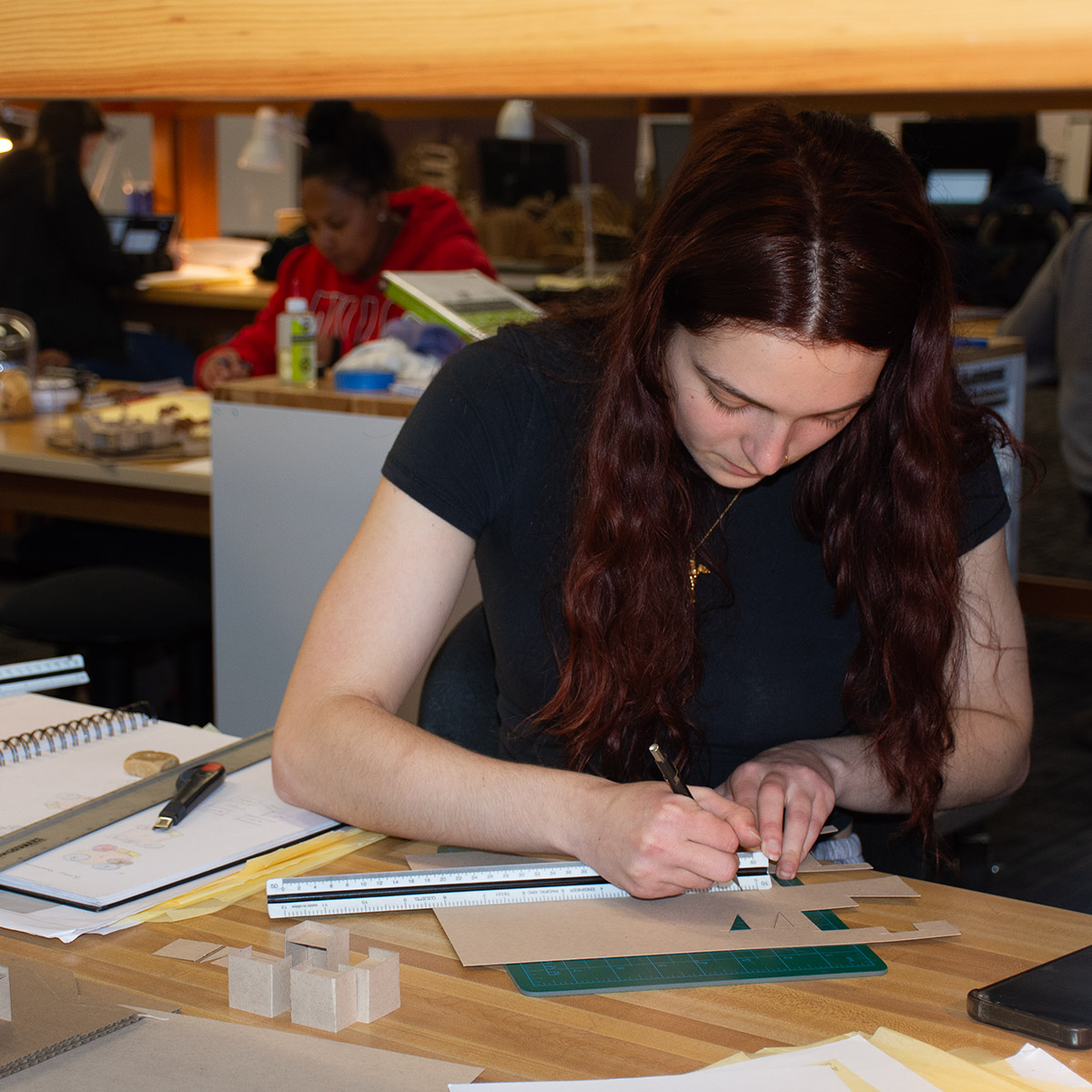 white, female 英雄联盟博彩竞猜 Architectural Technologies building a model