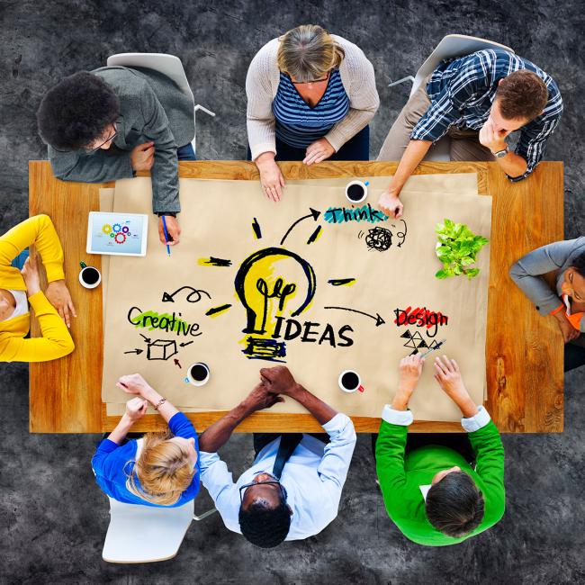 Designers sitting around a table